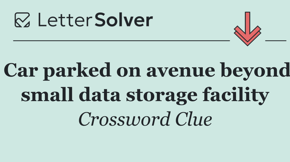 Car parked on avenue beyond small data storage facility